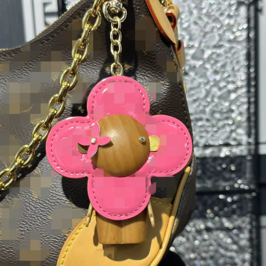 Designer Sunflower Bag Charms Luxury Fashion Brand Pendant Metal Four Leaf Clover Backpack Charm Car Key Ring Retro Accessory Christmas Gift - Image 5